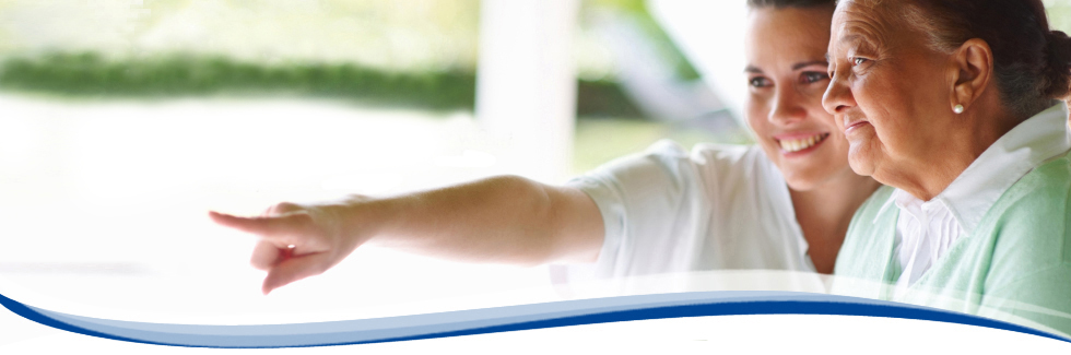 Precise Home Care caregiver assisting elderly patient at home